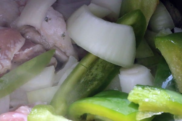 pieces of pork roast, sliced onions and green bell pepper