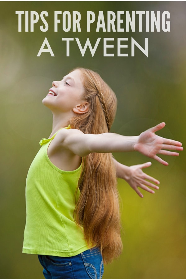 a tween girl standing with her arms spread behind her with title text reading Tips For Parenting a Tween