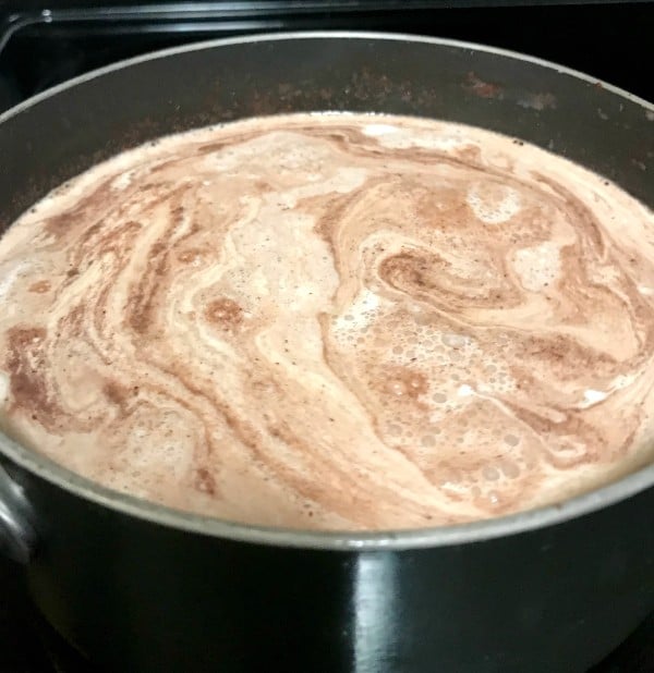 chocolate melted in a pot of milk