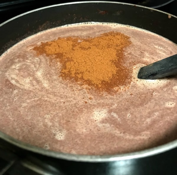 whipped cream, spices, melted chocolate and milk in a pot