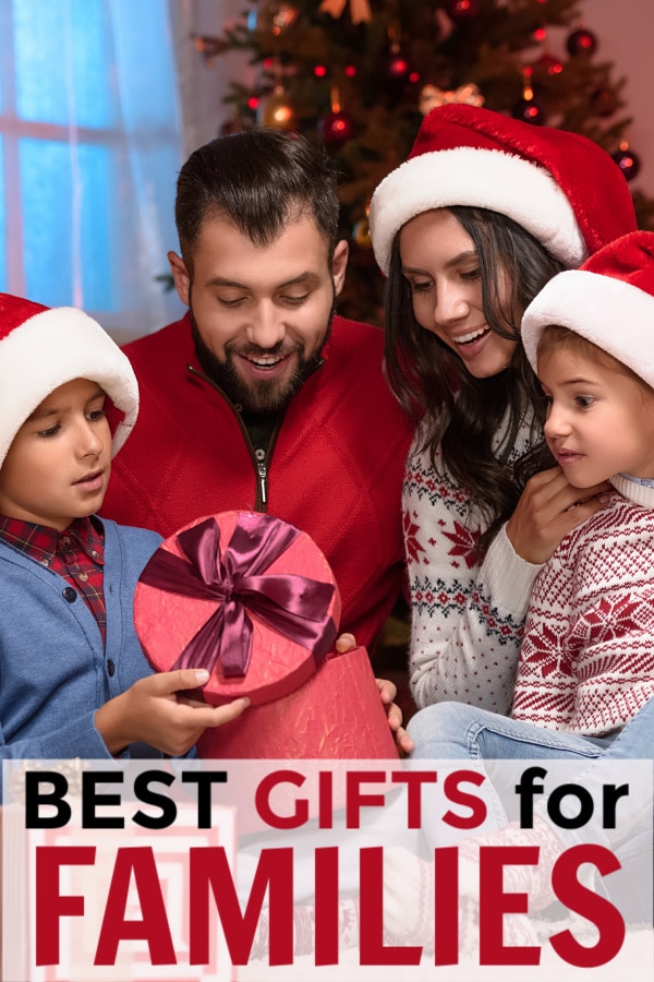a mom, dad and two kids opening a present with a Christmas tree in the background with title text reading Best Gifts for Families