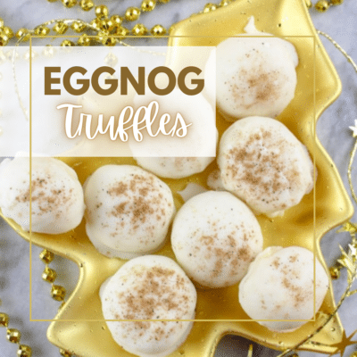 Rich eggnog truffles elegantly presented on a gold plate.