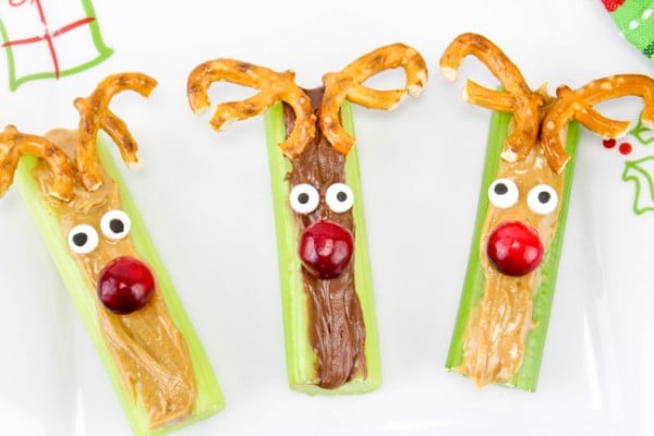 celery filled with peanut butter or nutella with candy eyes, a tomato nose and pretzel antlers so they look like reindeer