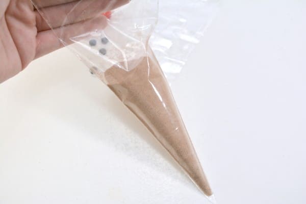 hot cocoa mix in a cone shaped plastic bag