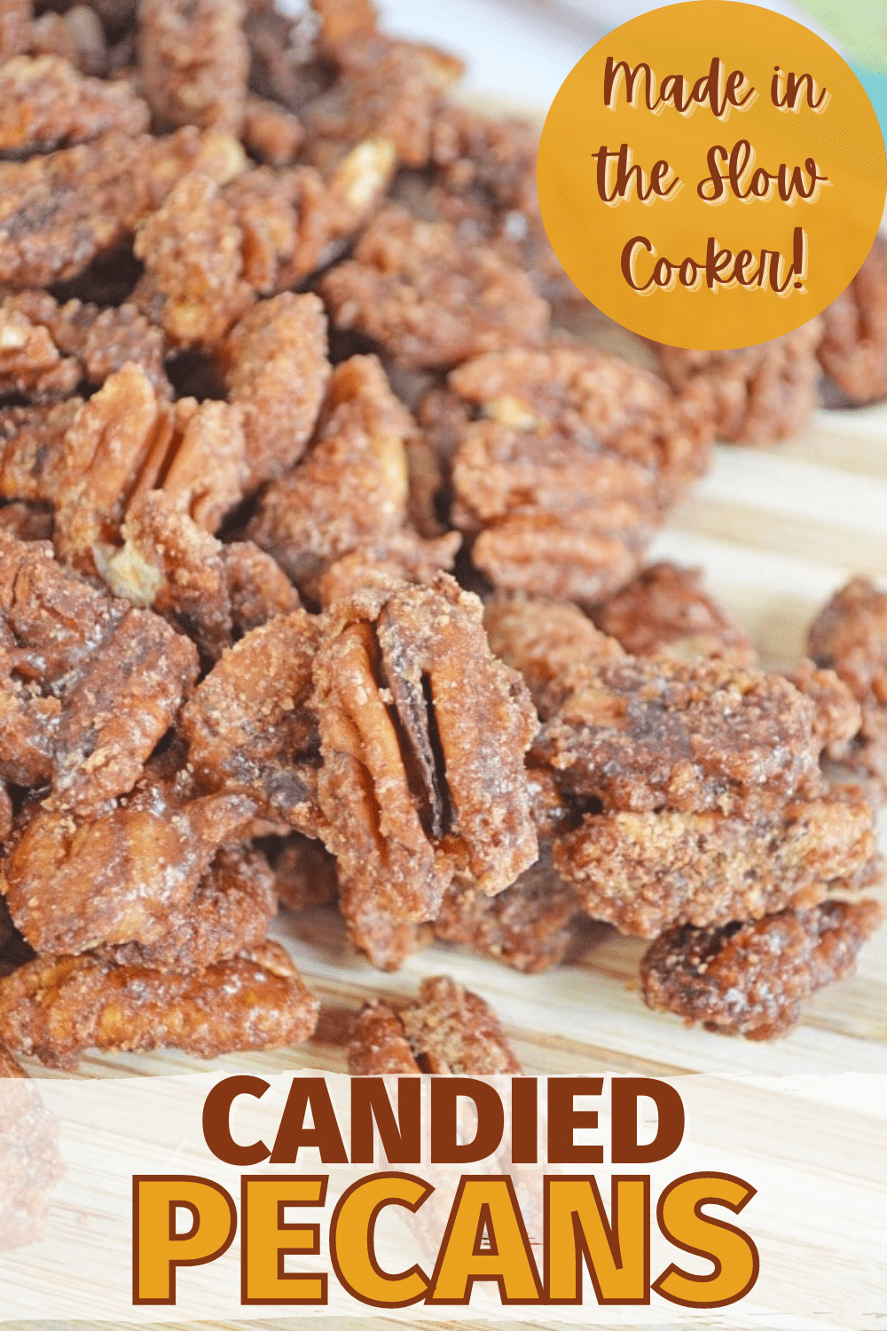 Slow Cooker Candied Pecans displayed on a cutting board.