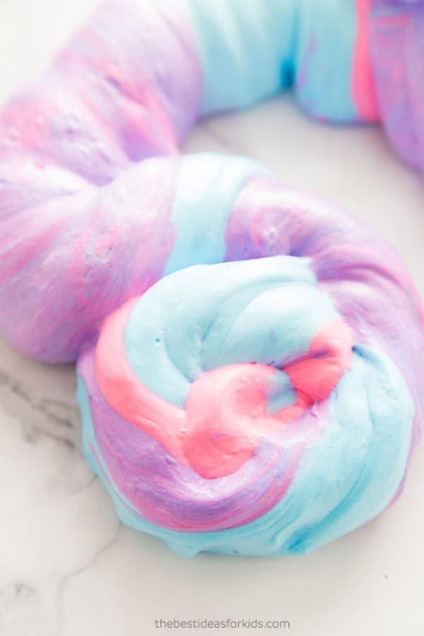 blue, pink and purple slime on a counter