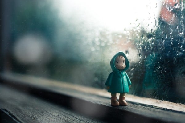 a figurine on a windowsill