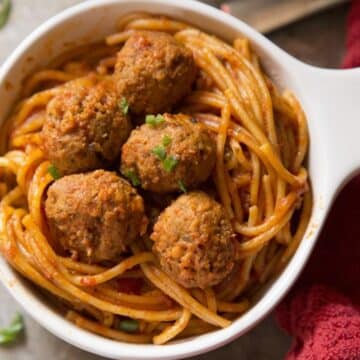 Instant pot spaghetti and meatballs in a white bowl.