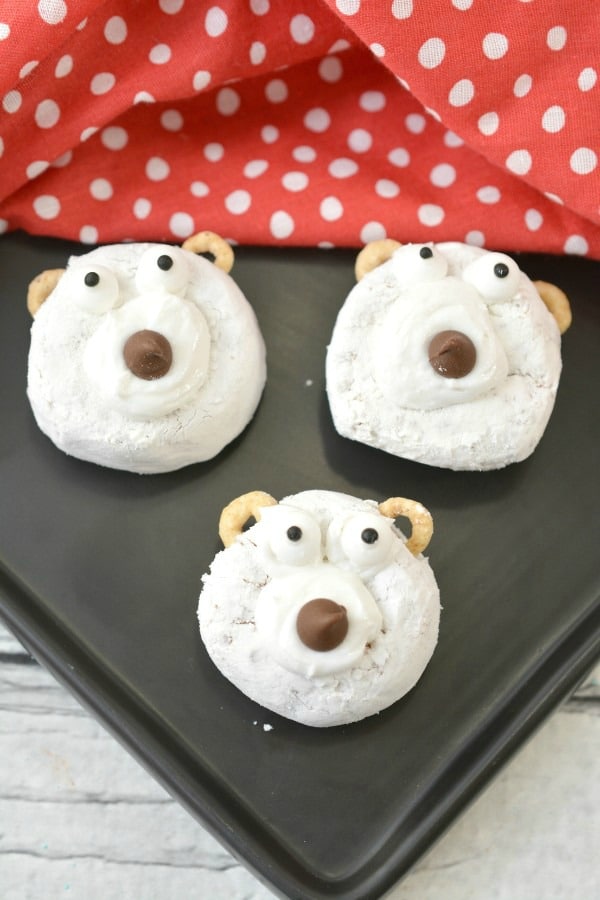 Polar Bear Donuts on a cookie sheet with a red and white polka dot cloth in the background