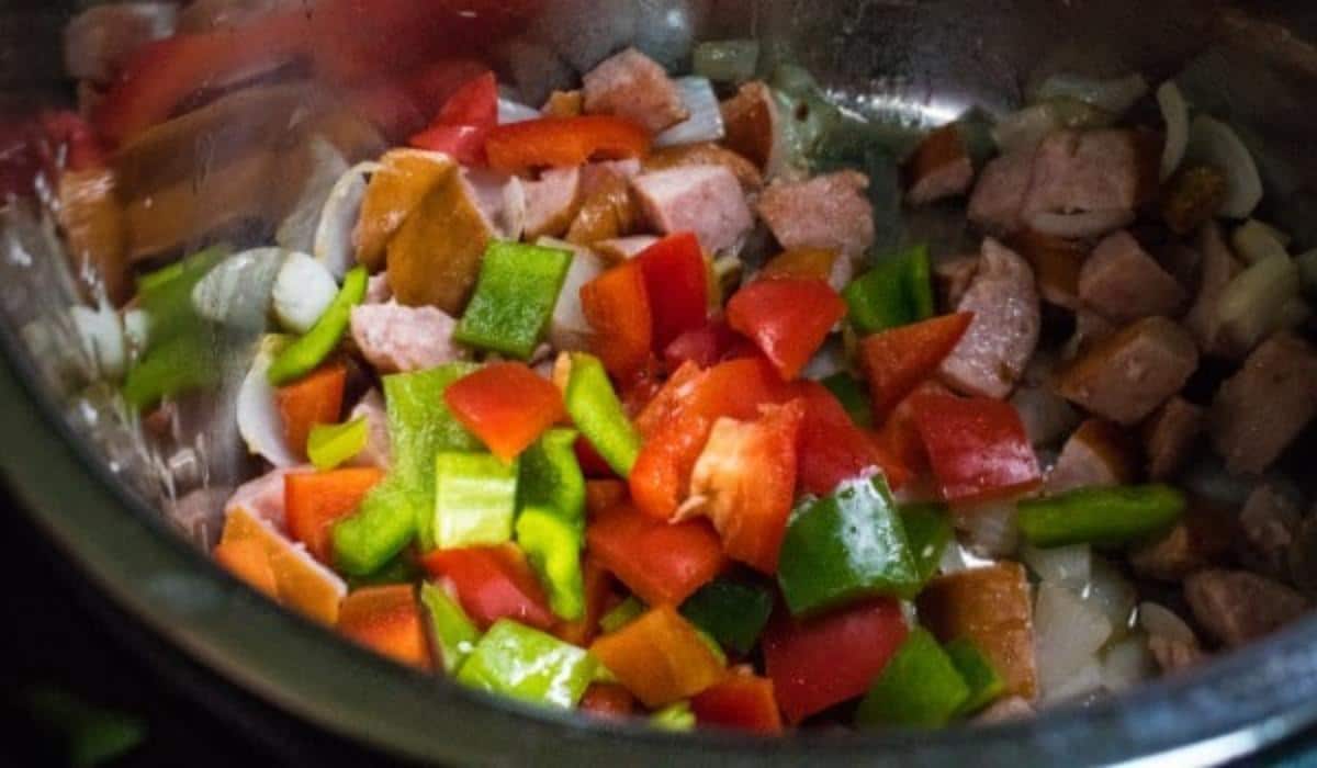 Sausage, onions, diced red and green bell peppers in an instant pot.