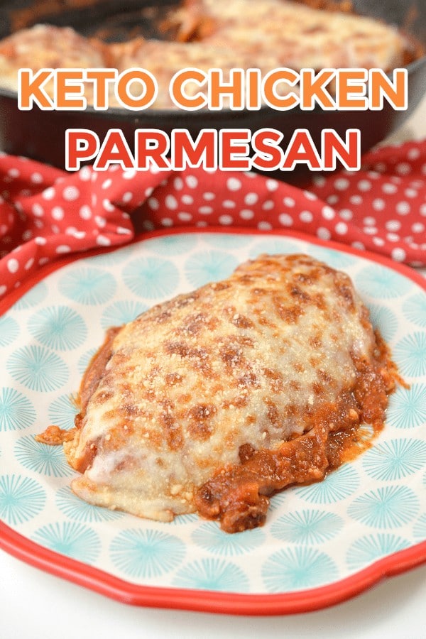 chicken topped with cheese and sauce on a blue and red plate with more chicken in a dish in the background with title text reading Keto Chicken Parmesan