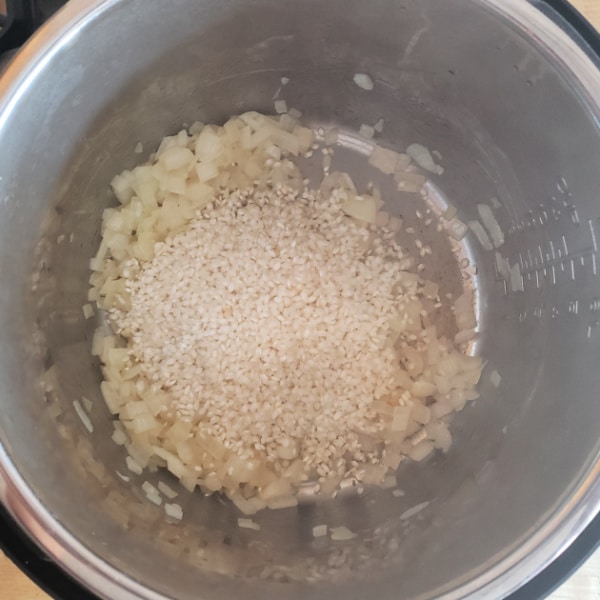 rice and diced onion in an instant pot