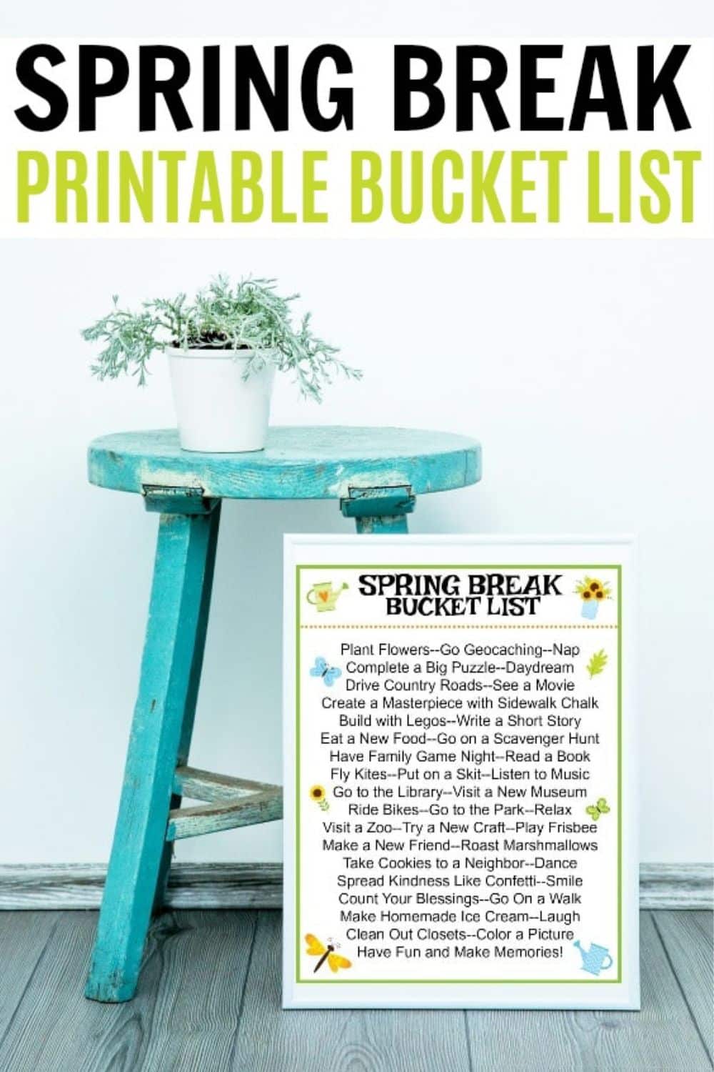 A "Spring Break Bucket List" poster displayed on a blue wooden table next to a potted plant.