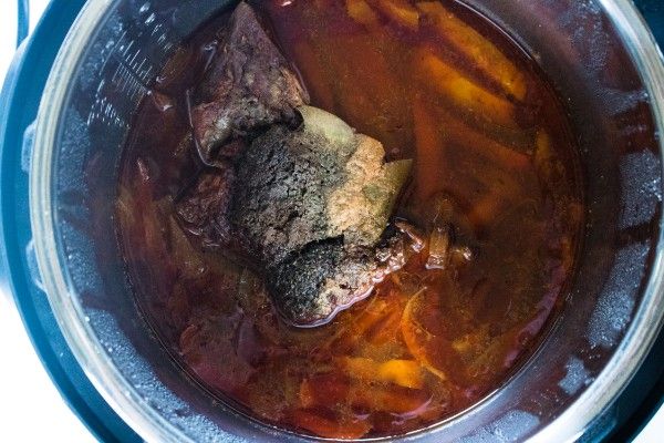 beef, vegetables and liquid in an instant pot