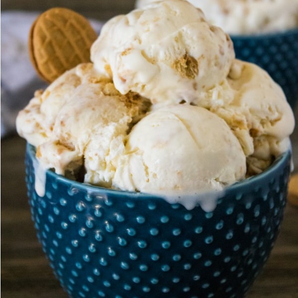 homemade Nutter Butter ice cream and a nutter butter cookie in a blue bowl