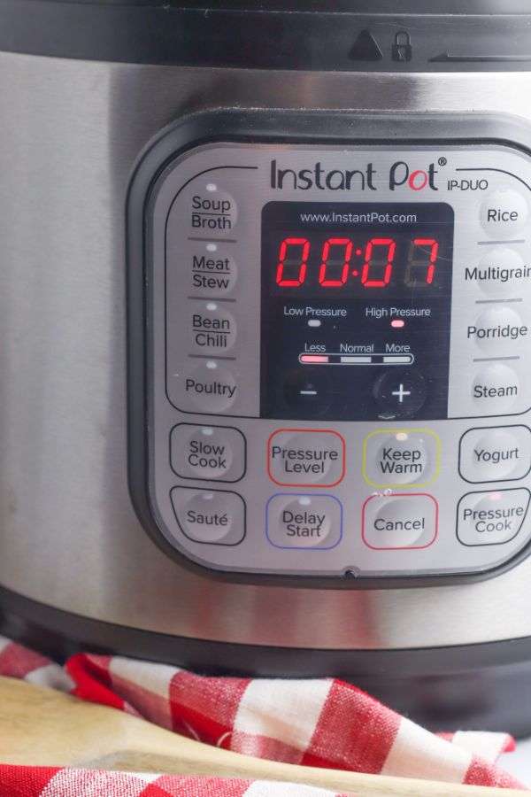 an instant pot with seven minutes remaining on the timer