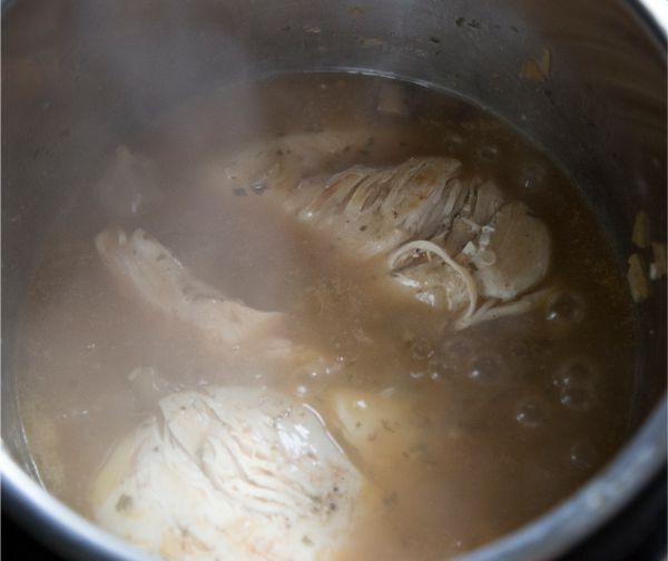 chicken and liquid in an instant pot