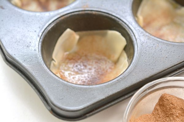 baked wonton wrappers in a muffin tin