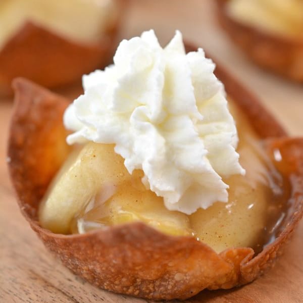 apple pie bite tipped with whip cream