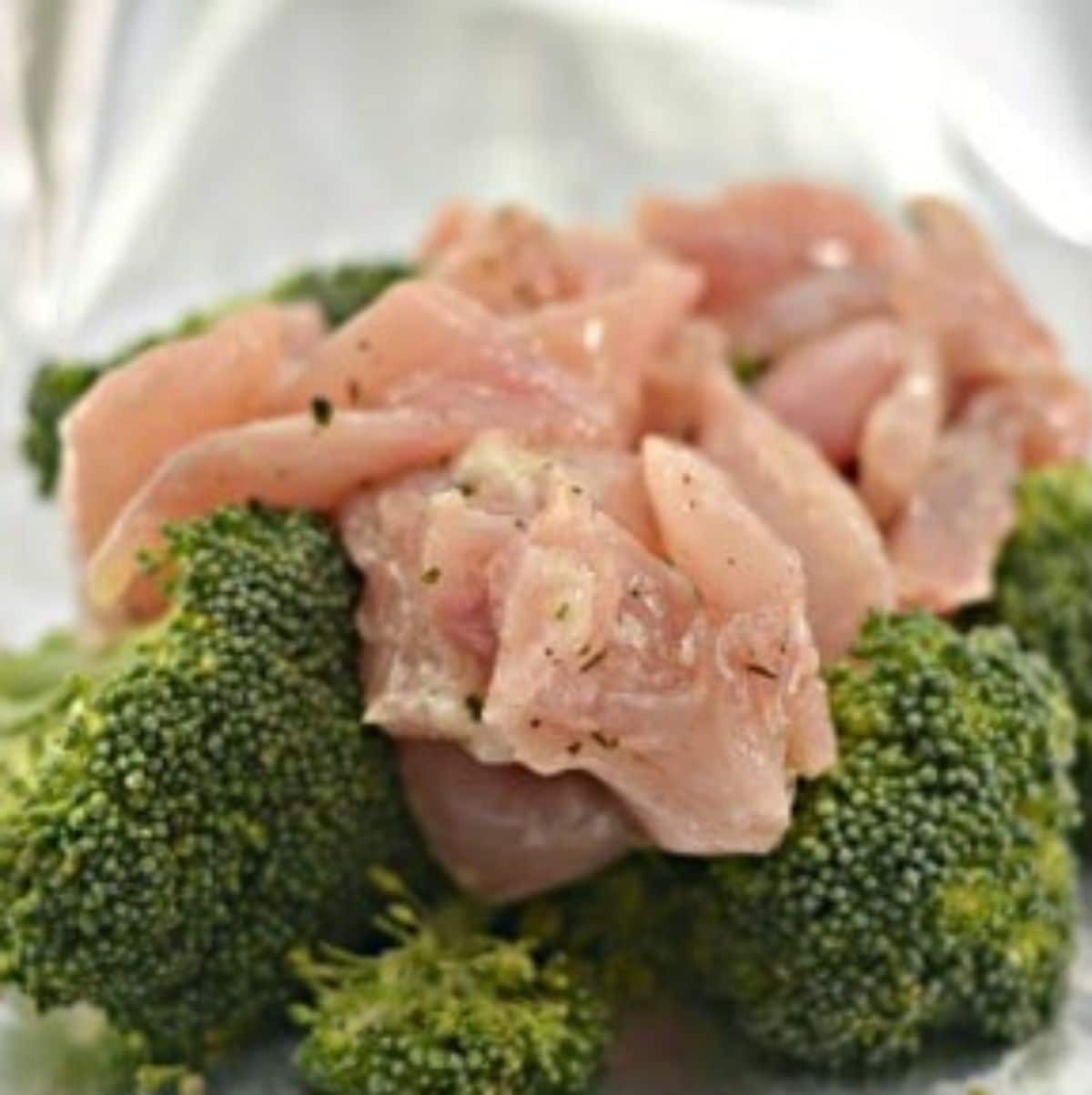 the chicken is added on top of the broccoli.