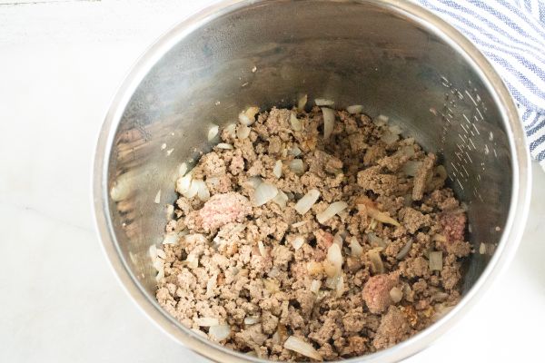 ground beef and onions in an instant pot