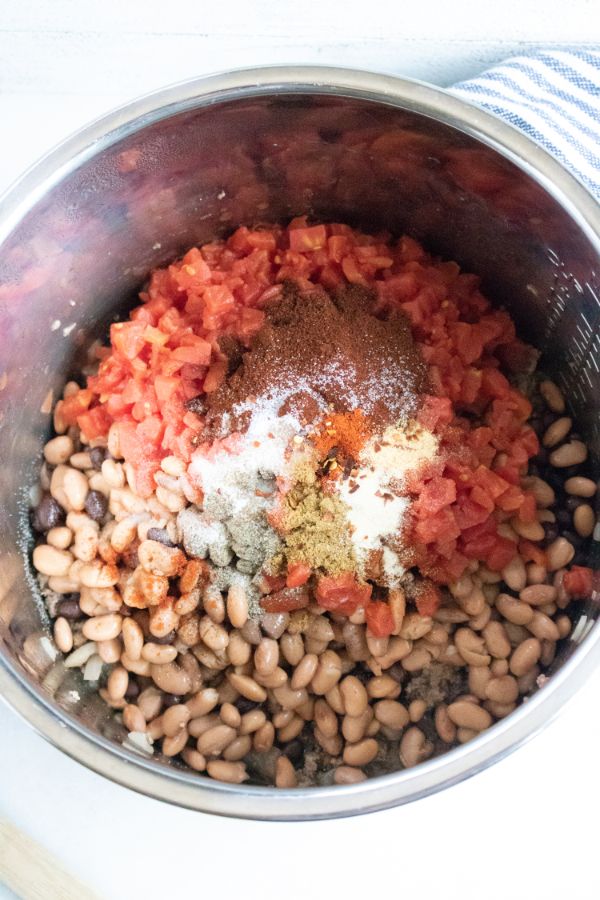 seasonings, tomatoes, beans and ground beef in an instant pot