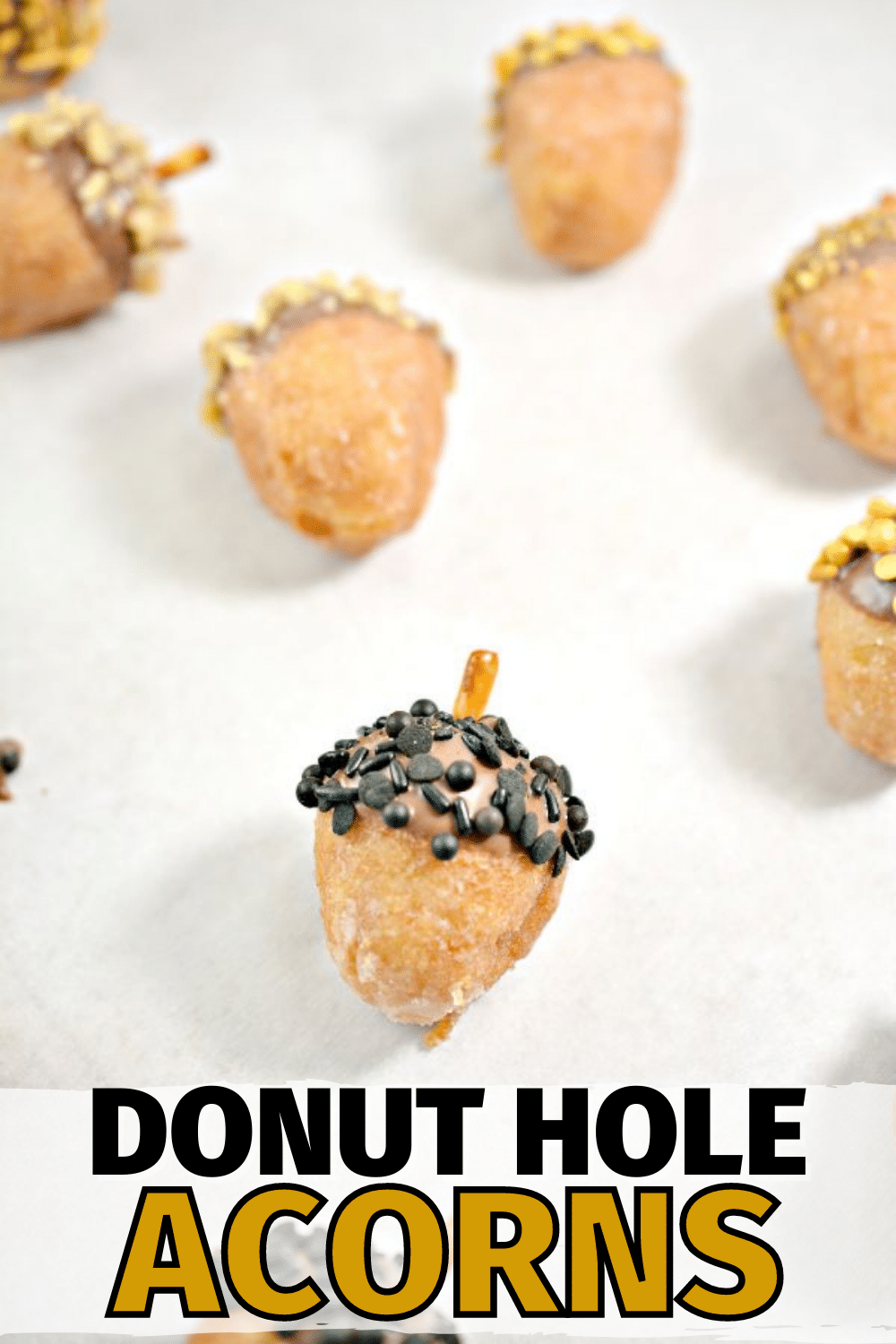 These Donut Hole Acorns are a perfect treat for fall parties. This easy dessert recipe only has four ingredients and these look lovely on the platter. #fall #acorns #donuts via @wondermomwannab