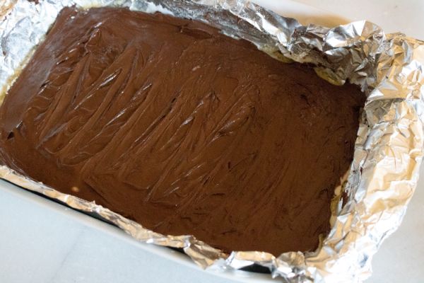 melted chocolate in aluminum foil in a pan