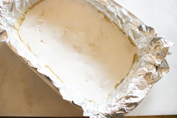 the dough in aluminum foil in a pan