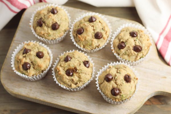 healthy chocolate chip muffins on large wooden spatula