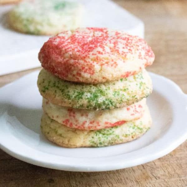 stack of 4 peppermint snickerdoodles on a white plate on a table