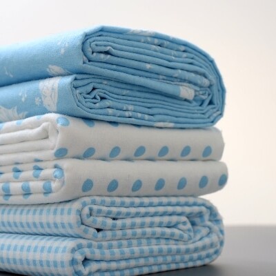 close up shot of blue patterned bed sheets to represent other uses for bed sheets