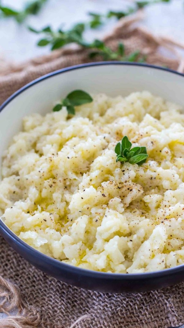 mashed cauliflower in a white and blue bowl