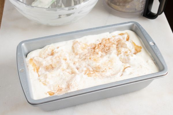 no churn apple pie ice cream in a metal baking pan on a white background