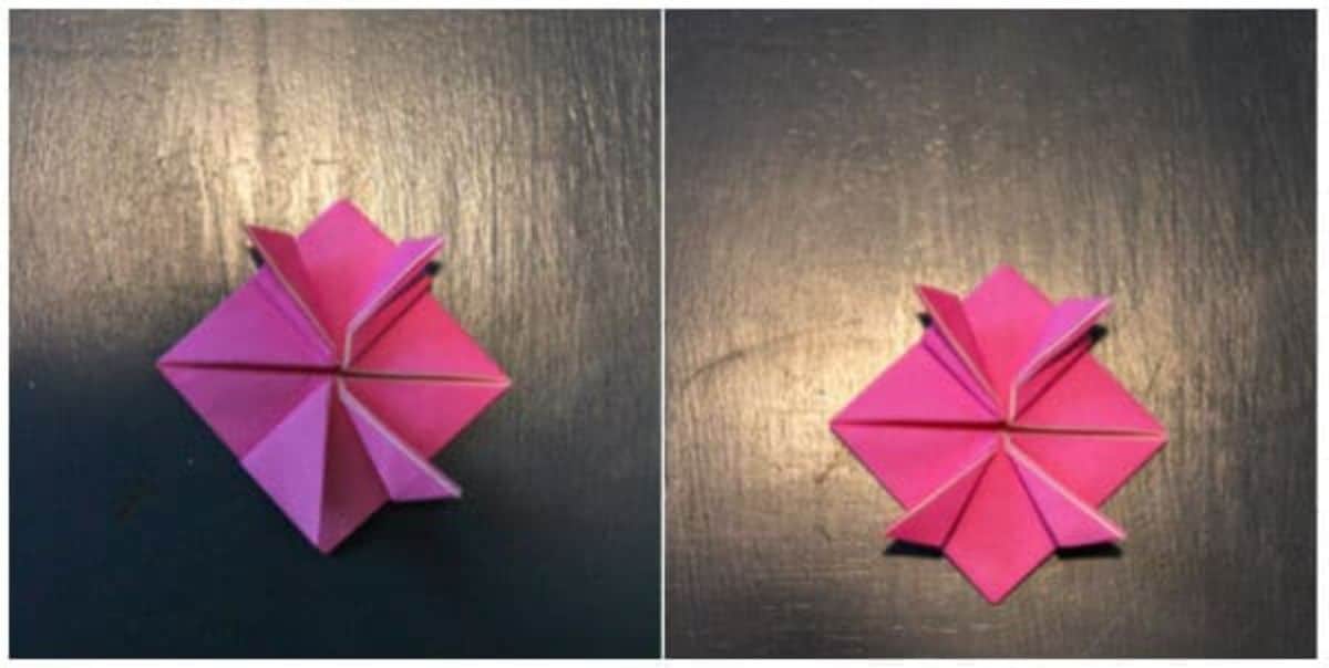 the origami paper is now folded so the bottom portion matches the top portion.
