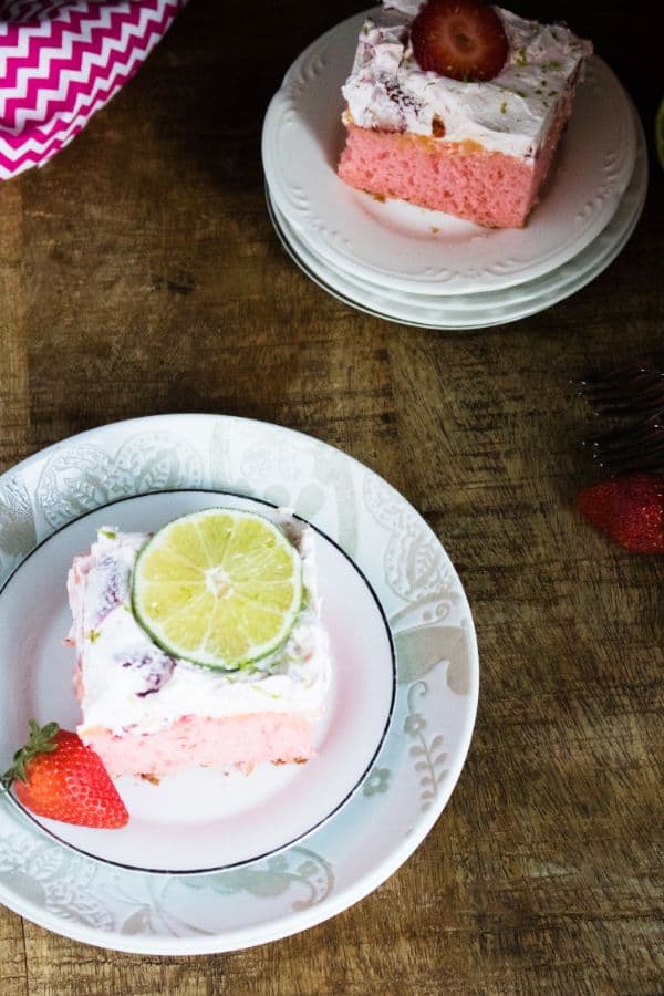 strawberry margarita poke cake on plate