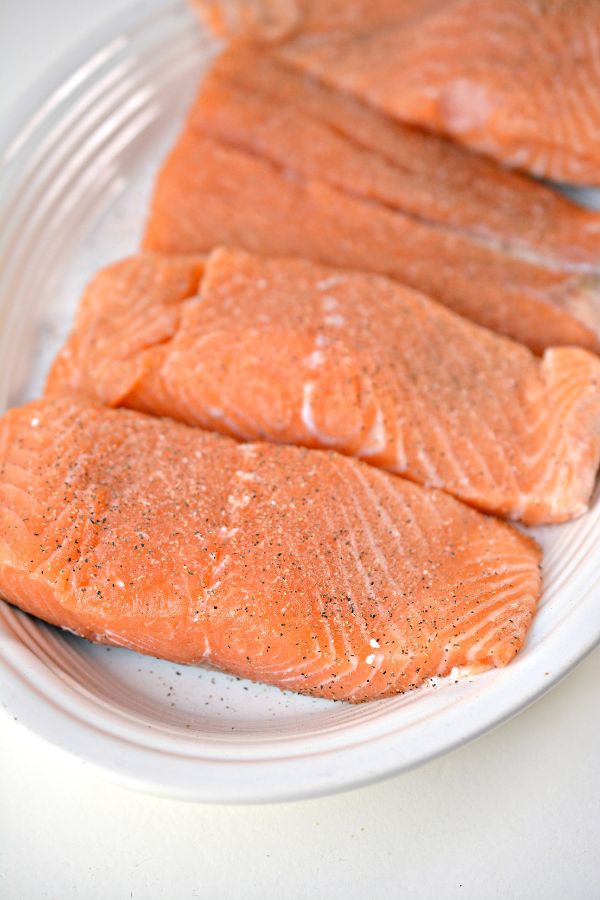 raw Salmon with seasoning on it in a dish