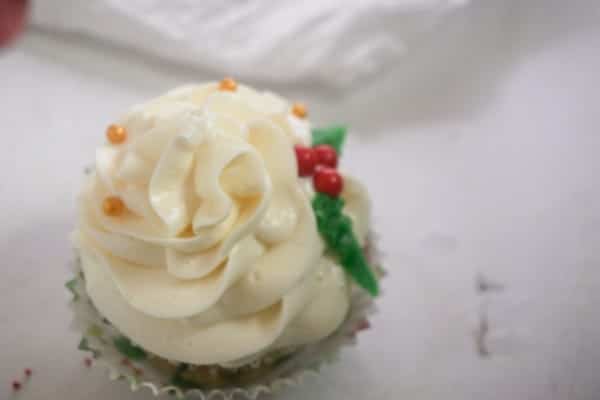 a Christmas holly cupcake