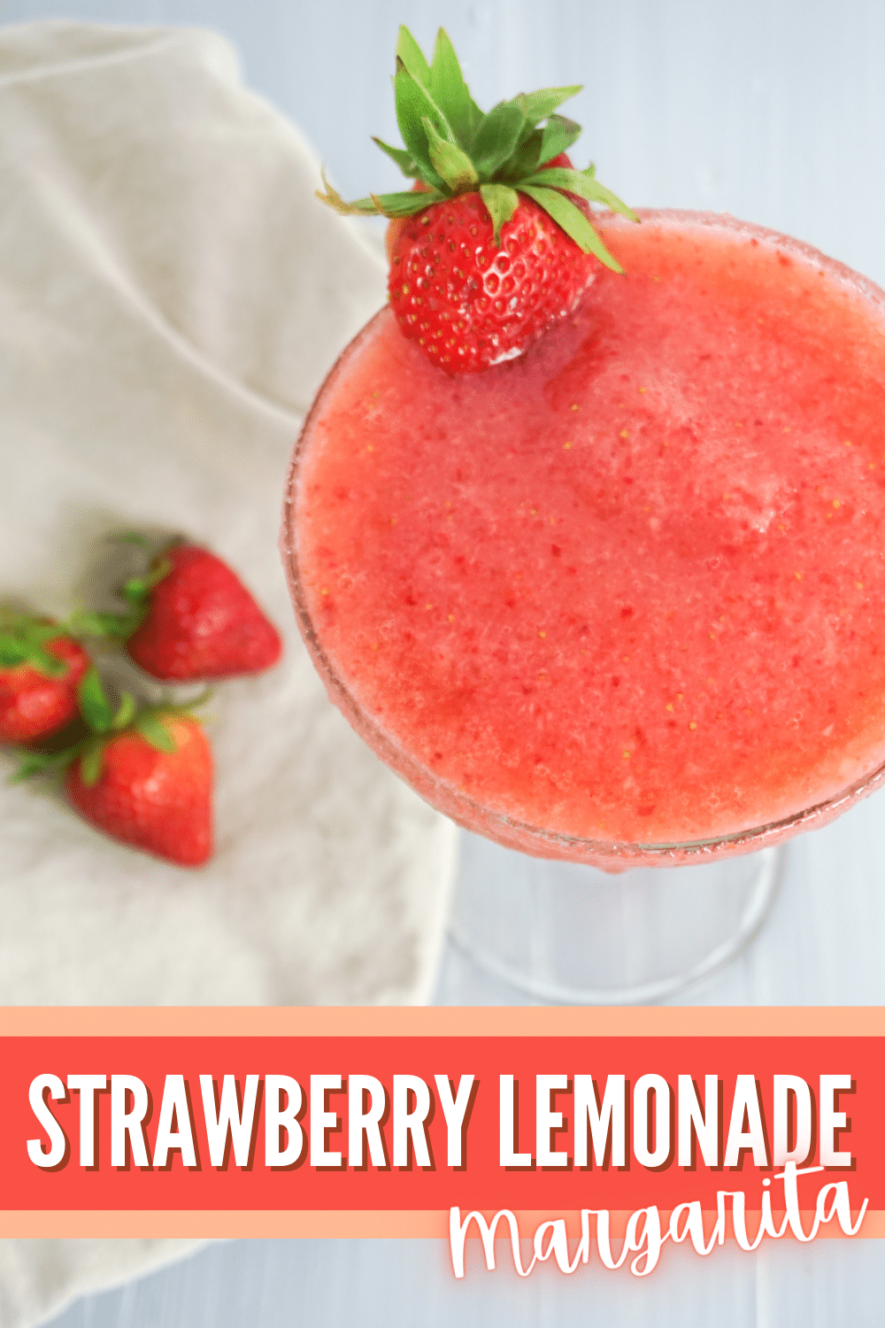 This Strawberry Lemonade Margarita is a refreshing and delicious twist on the classic margarita. It will tantalize your taste buds. #lemonademargarita #strawberrylemonademargarita #margaritas #margaritarecipes #pinklemonademargarita via @wondermomwannab