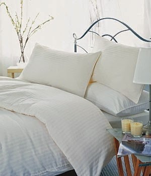all white bedding as one of the bed linen tips tricks for a pretty bedroom