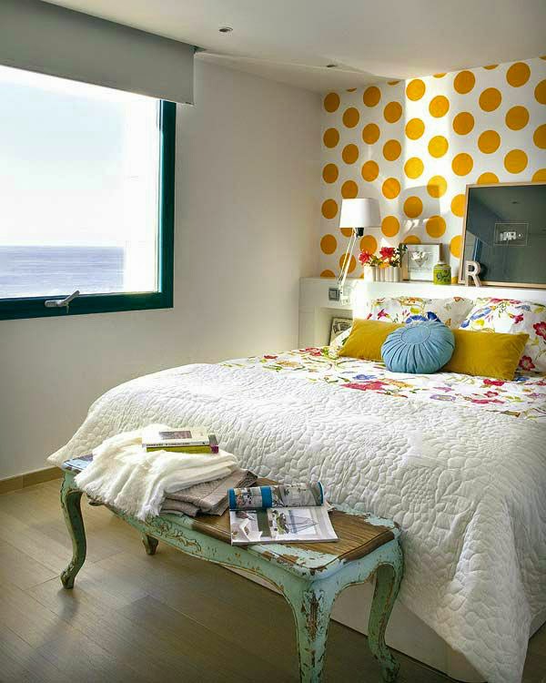 bedding with flowers on it to match the yellow wall
