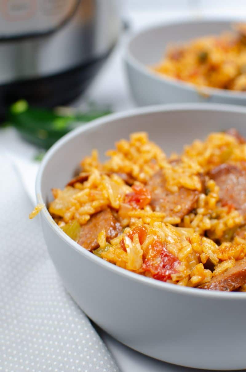 Instant pot chicken jambalaya has chunky bites of andouille sausage that contrast perfectly with veggies and rice for your weeknight dinner!  With this Louisiana instant pot jambalaya recipe, you'll need just 30 minutes to make this quick and wholesome meal! #instantpot #jambalayarecipe #chickenjambalayarecipe #instantpotjamabala #onepotdinner #spicyjambalaya #sausagejambalaya via @wondermomwannab