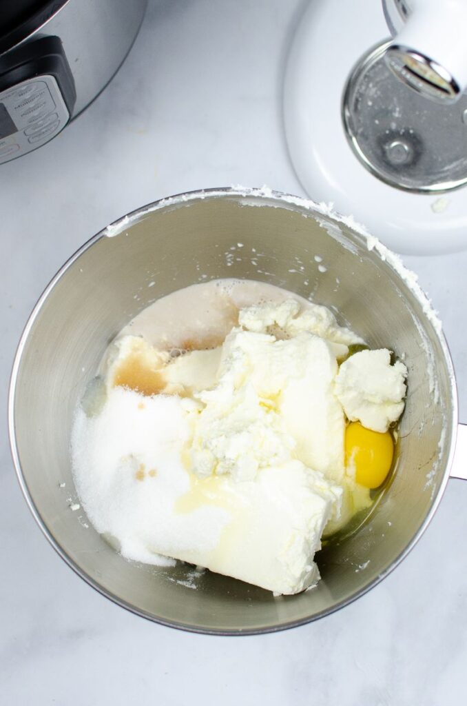 Cream cheese, eggs, vanilla, heavy cream, and sugar in an instant pot.