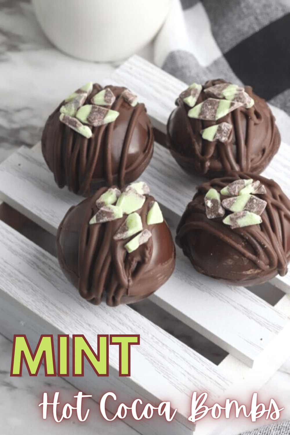 These Mint Hot Cocoa Bombs are a dream come true for mint fans. From your first sip, you're going to love this delicious and easy recipe! #hotcocoabombs #hotcocoa #mint #dessert #recipe via @wondermomwannab