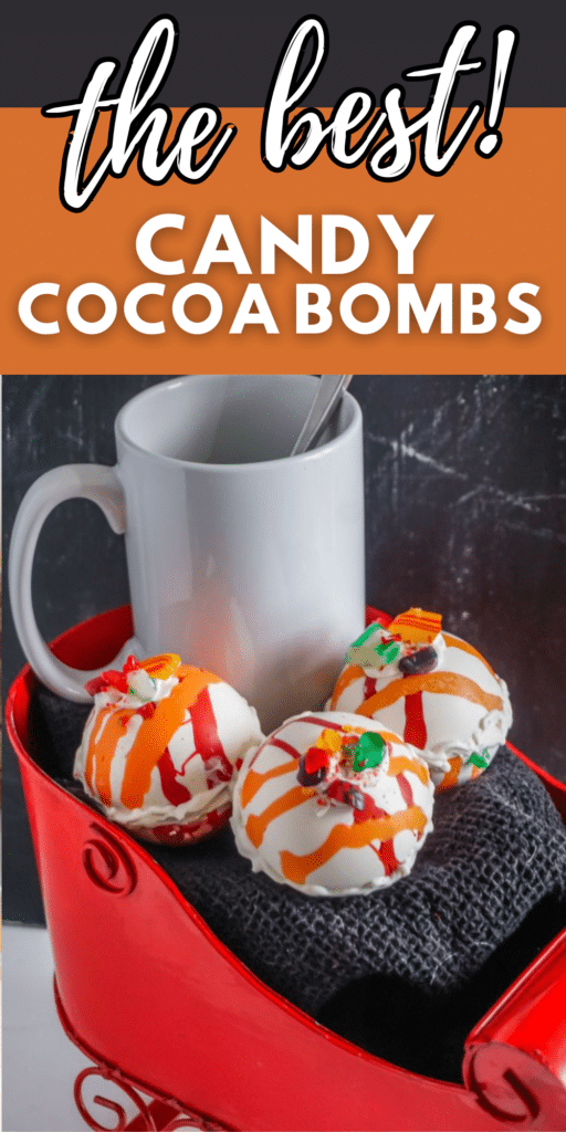 hot cocoa bombs next to a white mug in a red sleigh with title text reading the best Candy Cocoa Bombs