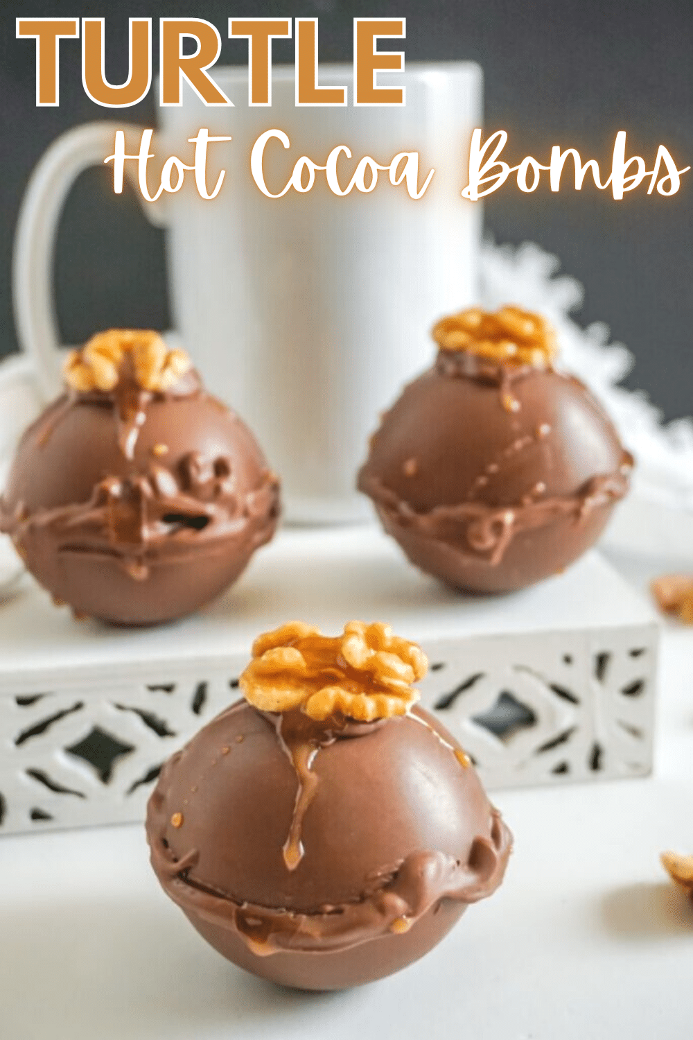 These Turtle Hot Cocoa Bombs are a delight. With the walnut & caramel on top, & the flavor of the added ingredients, the taste is spot on! #hotcocoabombs #hotcocoa #turtlechocolates #dessert #recipe via @wondermomwannab