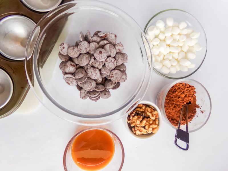 ingredients in glass bowls needed to make turtle hot cocoa bombs