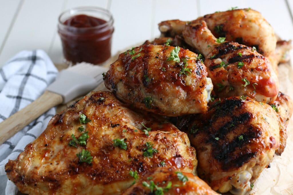 easy grilled chicken on platter with BBQ sauce 