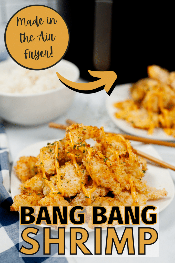 Bang Bang Shrimp on a white plate with more shrimp, a bowl of rice and an air fryer in the background with title text reading Made in the Air Fryer Bang Bang Shrimp