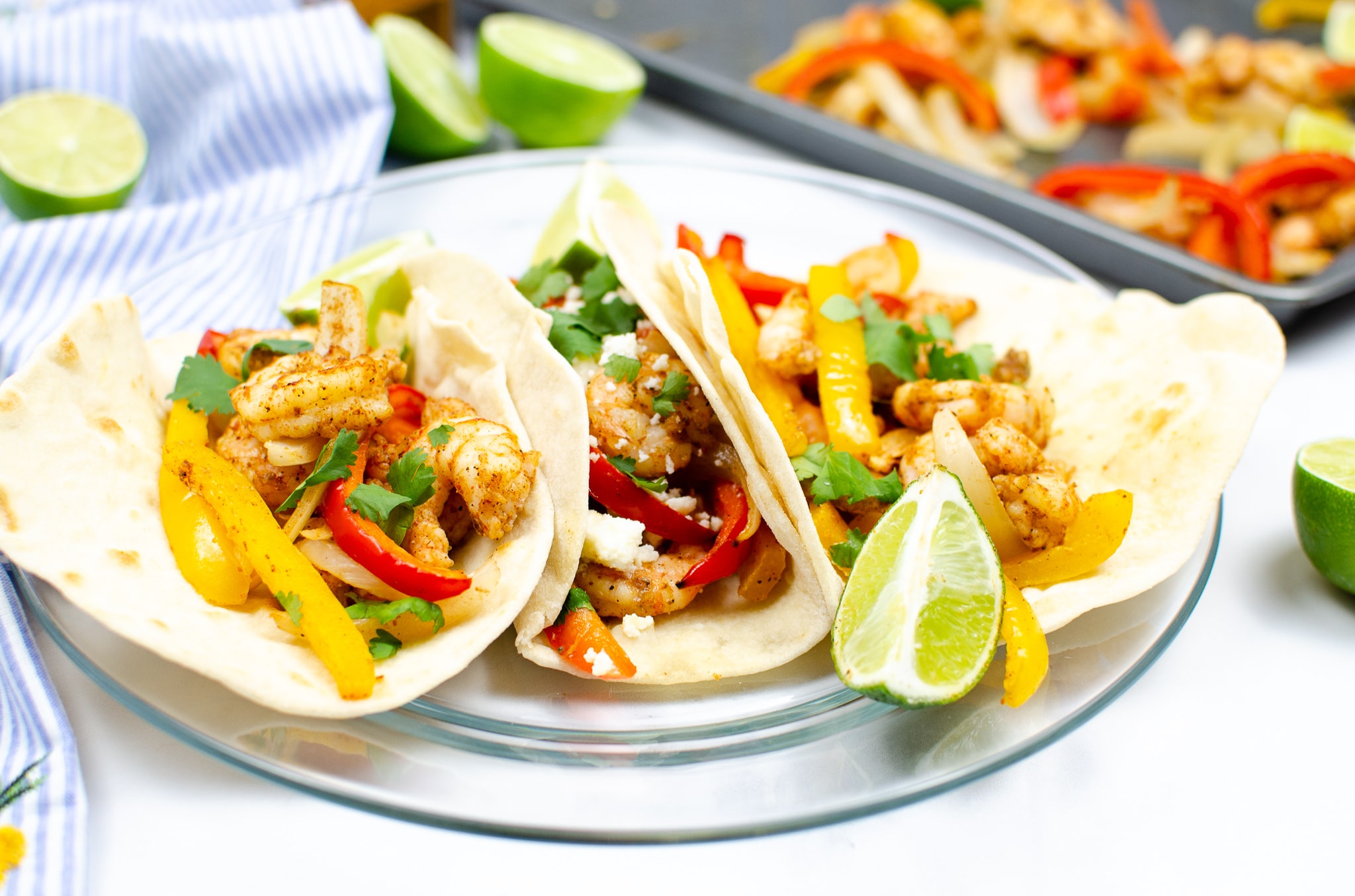 three shrimp fajitas on white plate